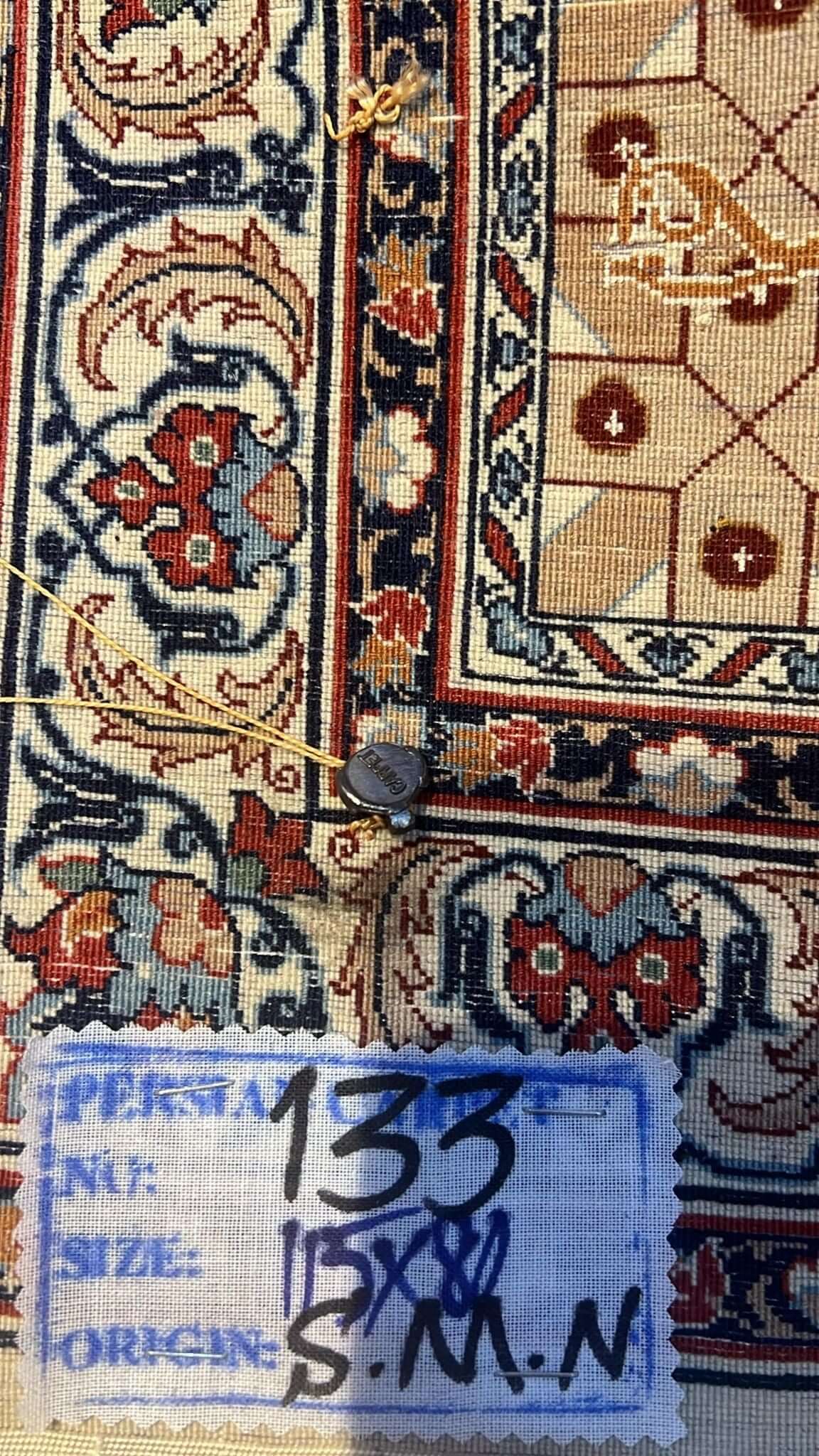 Backside of the beige Seirafian pictorial Persian rug, revealing the fine hand-knotted craftsmanship.